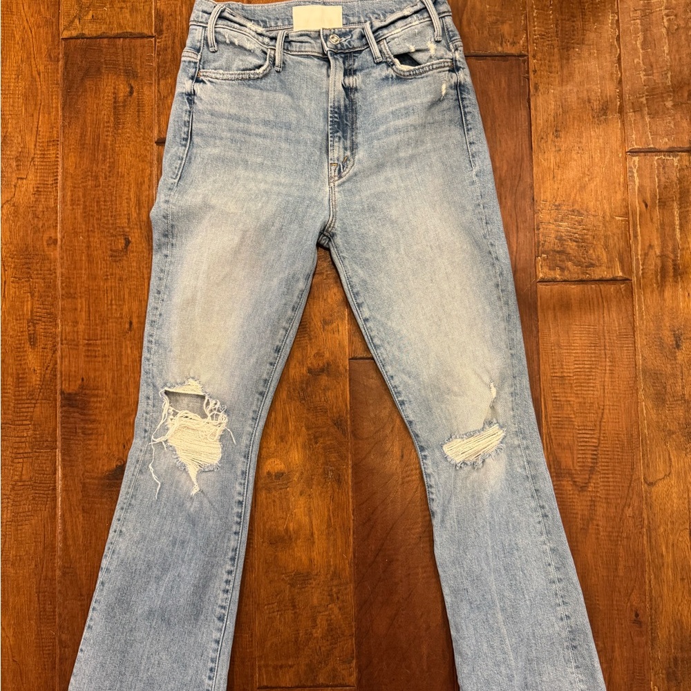 MOTHER Light Blue Flare Jeans with Distressed Details